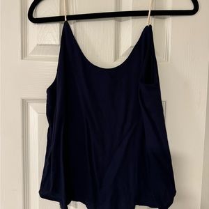 Navy top with dainty cream straps.